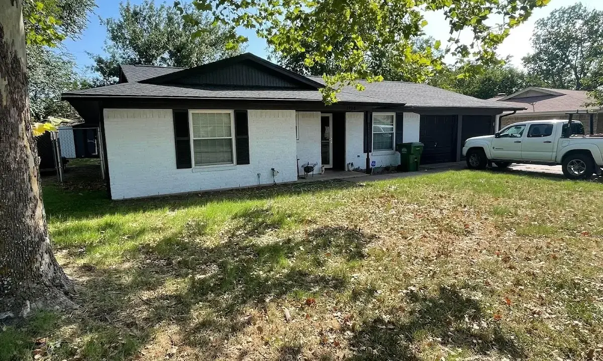 Professional roofing crew working on a residential roof in Euclid